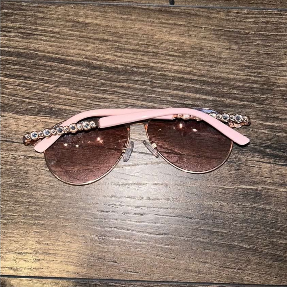 Rose gold sunglasses.